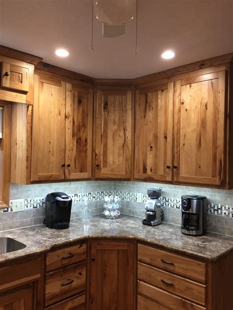 kitchen with hickory cabinets and stainless steel appliances|best backsplash for hickory cabinets.